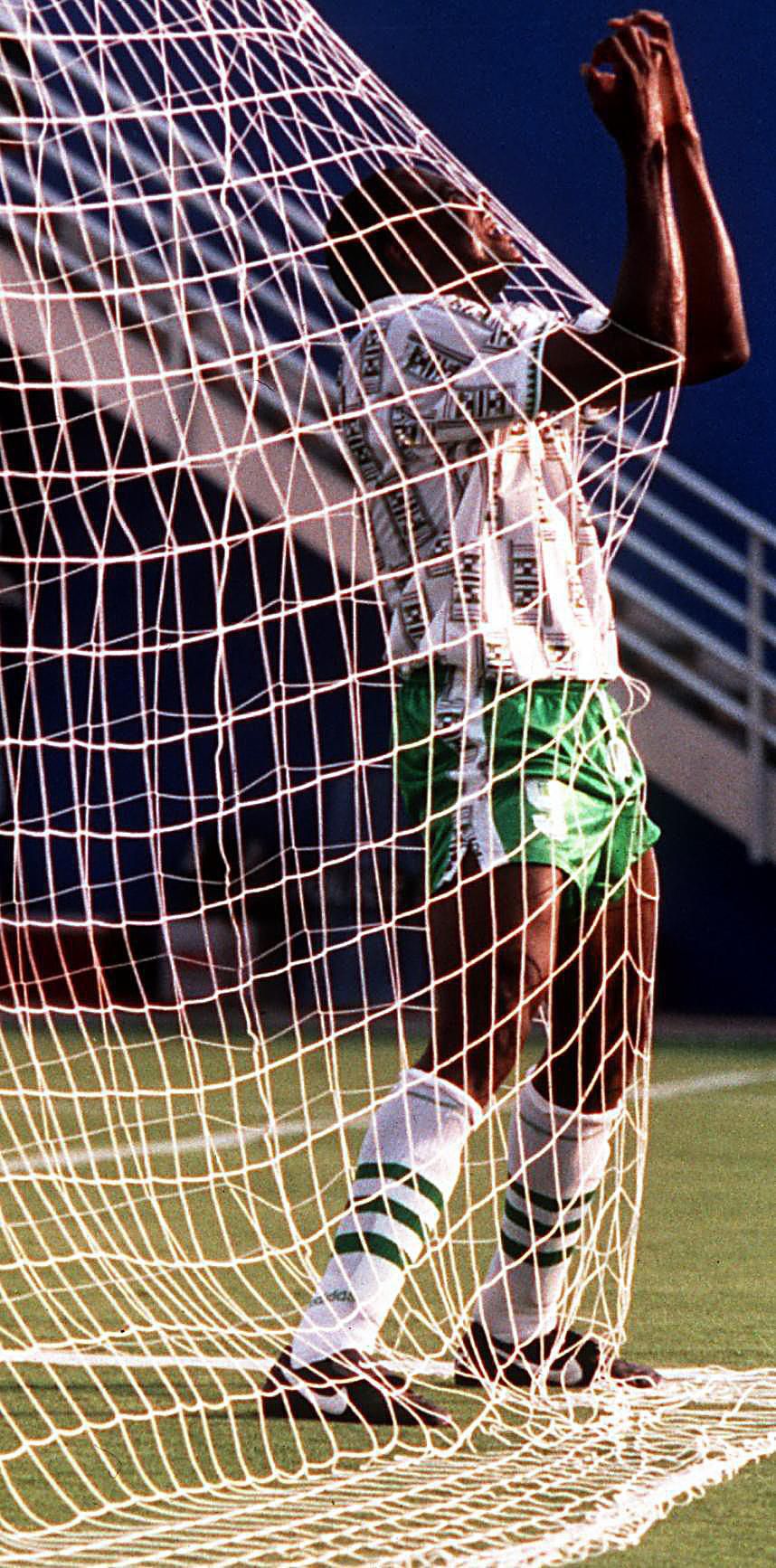 Nigeria's Rashidi Yekini celebrates in the net after scoring his nation's first goal of their game against Bulgaria during their World Cup game at the Cotton Bowl in June 1994.