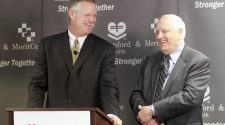 Sanford Health President and CEO Kelby Krabbenhoft, left, and MeritCare President and CEO Dr. Roger Gilbertson during a light moment at the Nov. 2, 2009, announcement of the merger of the two health care organizations. Forum file photo