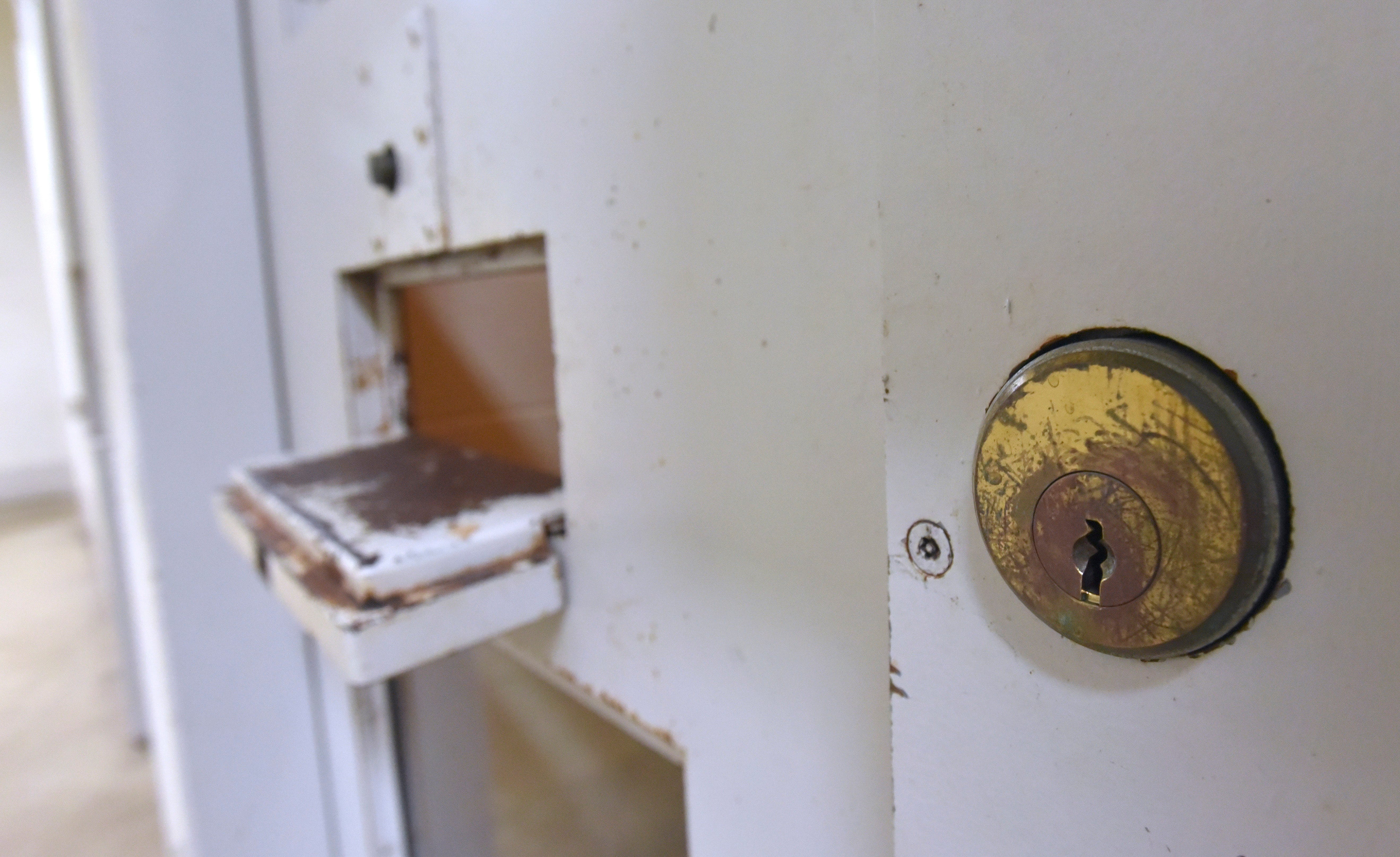 The jail-cell lock is situated near the food/cuff port.