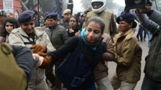 Police detain a woman at a demonstration against Indias new citizenship law in New Delhi on December 19, 2019.