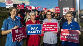 Nurses on strike holding placards outside the Ulster Hospital