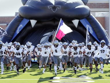 Guyer players take the field before the start of their 6A Div. 2 state semi-final game against Spring Westfield Saturday, Dec. 14, 2019 at the Sheldon ISD Panther Stadium in Houston, TX.