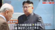 A man walks past in front of TV screen showing North Korean leader Kim Jong Un in Tokyo, Monday, Dec. 9, 2019. North Korea said Sunday that it carried out a "very important test" at its long-range rocket launch site that it reportedly rebuilt after having partially dismantled it at the start of denuclearization talks with the United States last year.