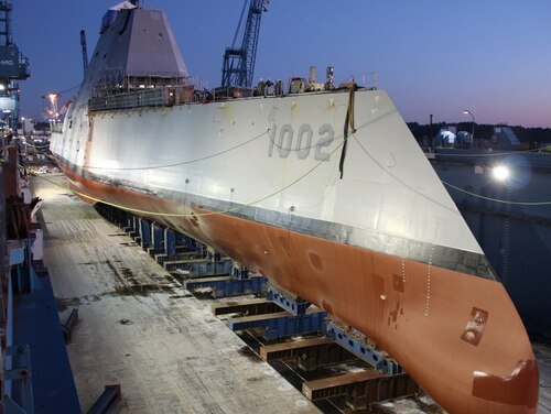 The future guided-missile destroyer Lyndon B. Johnson was made ready before flooding of the dry dock at General Dynamic-Bath Iron Works shipyard on Dec. 9. The third Zumwalt-class destroyer was christened on Saturday. (General Dynamics-Bath Iron Works)