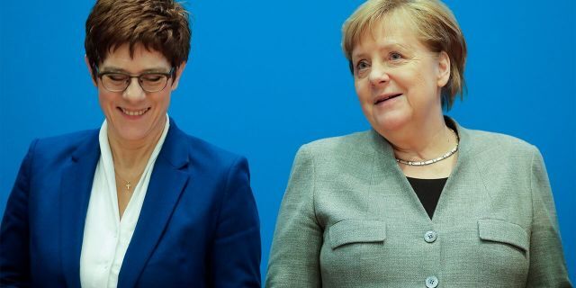 German Chancellor Angela Merkel, right, and CDU party chairwoman and Defense Minister Annegret Kramp-Karrenbauer, left, attend a party's board meeting at the headquarters in Berlin, Germany, Monday. (AP Photo/Markus Schreiber)