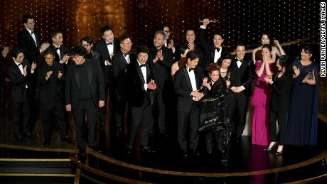 &#39;Parasite&#39; cast and crew, accepting the award for best picture