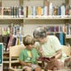 In this July 2015 photo, Maggie Winn reads a story to her grandson, Wayah Stone, 3, at the East Asheville Library. The library is well used and in need of renovation or expansion, and is slated for new construction next fiscal year in a proposed Buncombe County government plan.