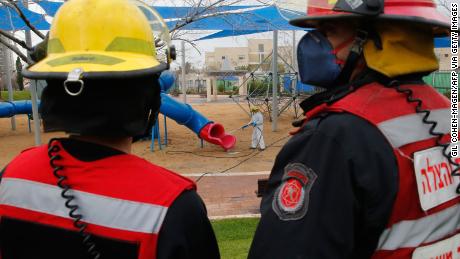 An Israeli firefighter sprays disinfectant in a children&#39;s playground in Modiin on Tuesday.