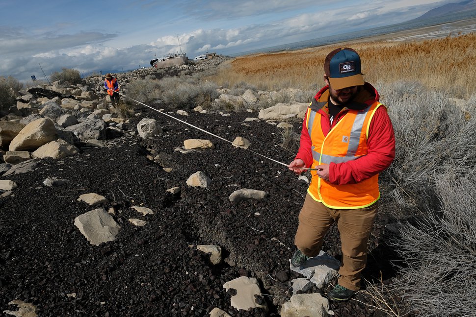 (Francisco Kjolseth | The Salt Lake Tribune) Emily Kleber and Adam Hiscock, both hazard geologists for the Utah Geological Survey, measure an extensive crack or lateral spread at the Great Salt Lake on Thursday, March 19, 2020, after Wednesday's earthquake.