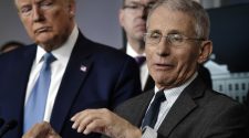 As Trump signals readiness to break with experts, his online base assails Fauci