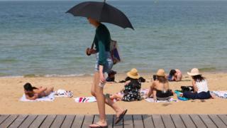 People flock to St Kilda beach as a heat wave sweeps across Victoria, Australia, 18 December, 2019.