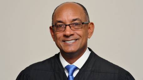 Nassau Administrative Judge Norman St. George poses for