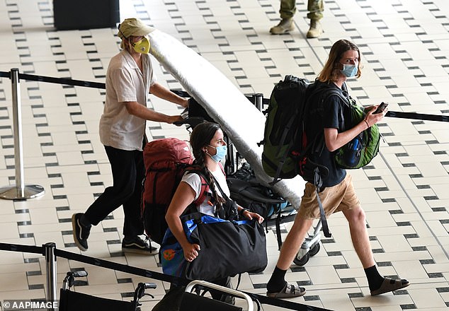 It comes as Australians continue to return home to see out the pandemic. Passengers returned on a special flight repatriating Australians from abroad (pictured on Thursday in Brisbane)