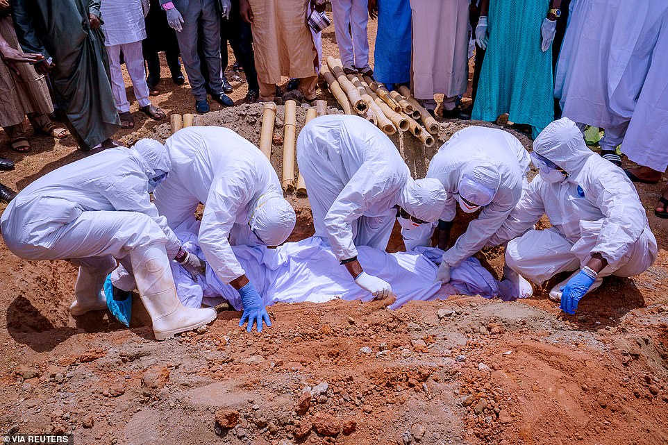 Nigeria's government said Abba Kyari, chief of staff to President Muhammadu Buhari, died Friday of COVID-19. 'May God accept his soul,' the statement said. Pictured: Being buried