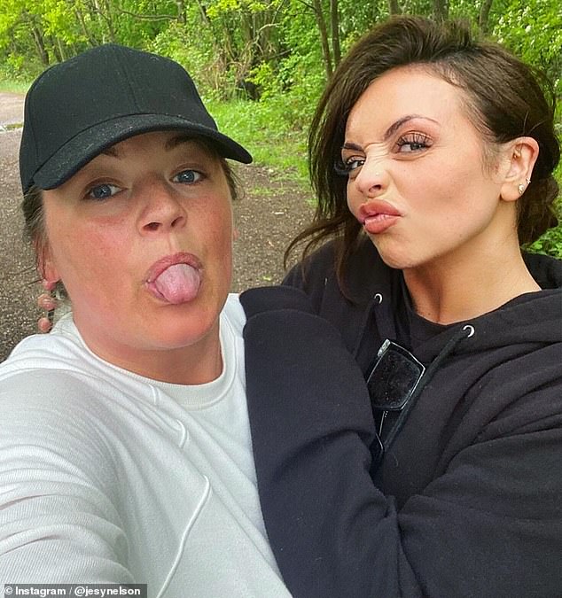 Simple pleaures: The natural beauty, 28, was joined by pal Charlotte Driver for her woodland stroll and told fans 'It's the simple things' that make you happy during this time