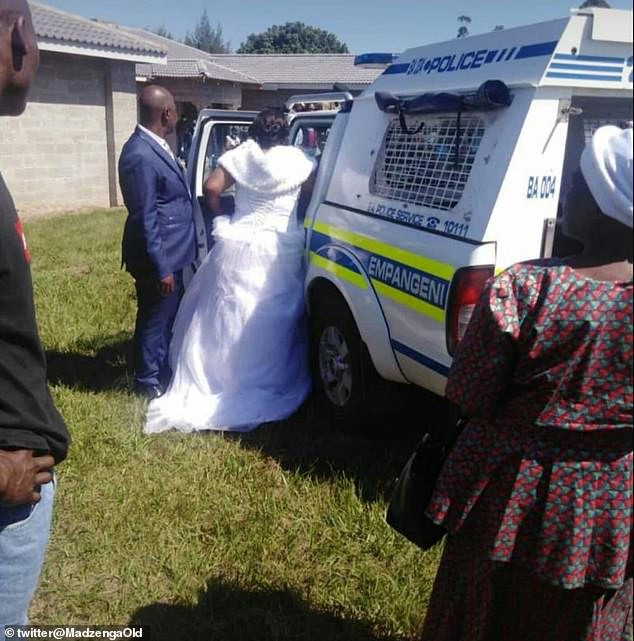 Jabulani Zulu, 48, and his bride Nomthandazo Mkhize, 38, said 'I do' in KwaZulu Natal province shortly before South African army officers stormed their wedding. The bride was escorted into the police car by her groom
