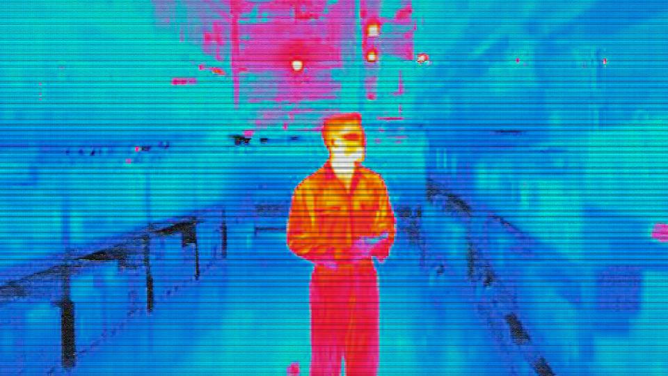 Infra red heat image of warehouse worker in factory