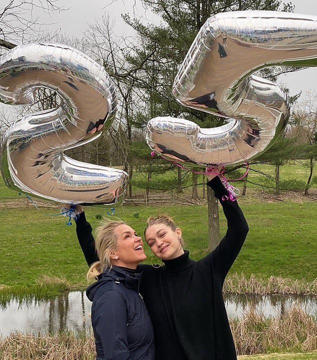 Big news: Eagle-eyed fans spotted pink and blue strings attached to her silver 25th  birthday balloons; she poses here with mom Yolanda