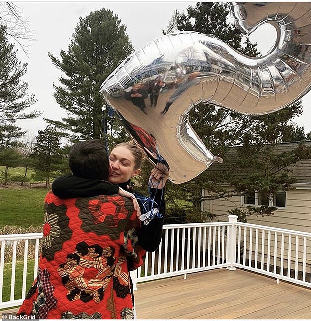 Birthday girl: Hadid embraced her boyfriend while celebrating her milestone 25th birthday