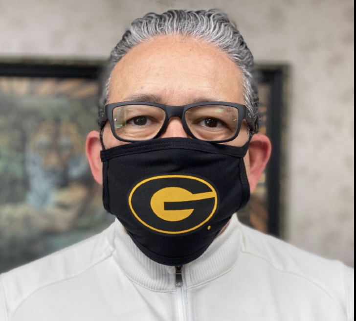 Grambling State University President Rick Gallot wears an officially licensed mask with the GSU logo.