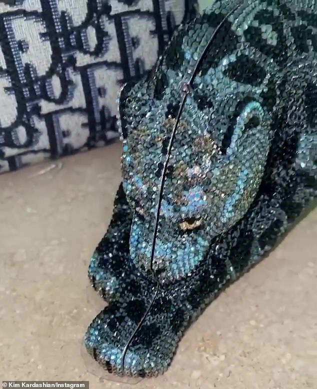 Shades of blue: Shortly after, Kim, 39, posted a video of her own matching cheetah clutch in blue, telling Kylie, 22: 'I mean, seriously Kylie? For Mother's Day? How beautiful'