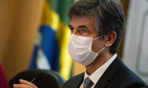 Brazilian Minister of Health Nelson Teich wearing a face mask reacts during the press conference to announce his resignation from office at the Ministry of Health on 15 May 2020 in Brasilia.