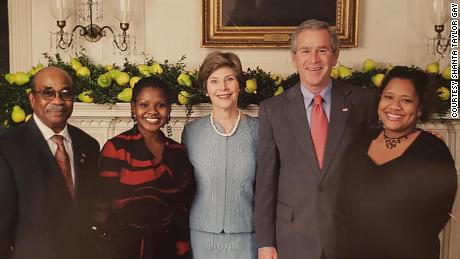 Former White House butler Wilson Roosevelt Jerman with then-President George W. Bush and first lady Laura Bush.
