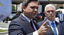 As Pence stands by, DeSantis unleashes on former health official