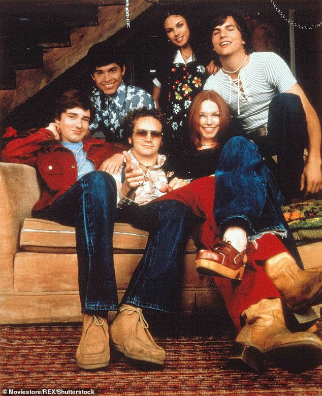 Danny Masterson is pictured in the sunglasses with his That '70s show co-stars