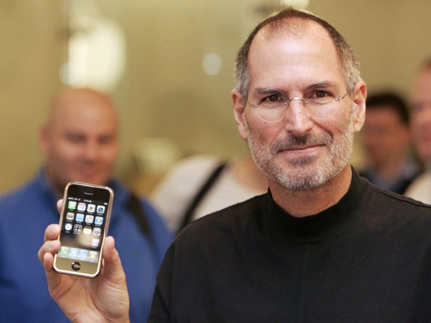 Steve Jobs poses with an iPhone during a press conference in Berlin 19 September 2007.