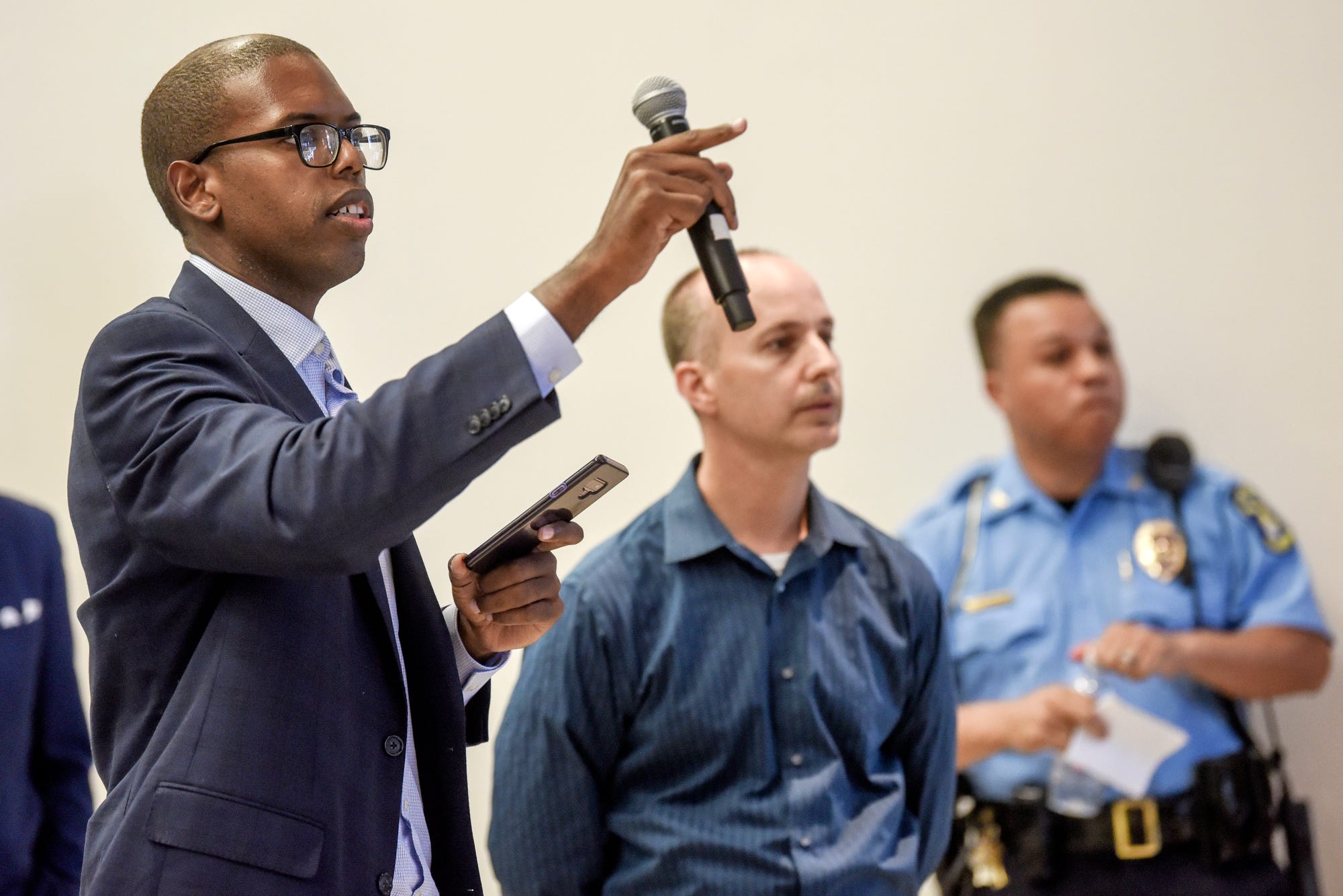 Ingham County Commissioner Derrell Slaughter calls on a person to speak during a gun violence meeting at city hall on Thursday, Aug. 8, 2019, in Lansing.