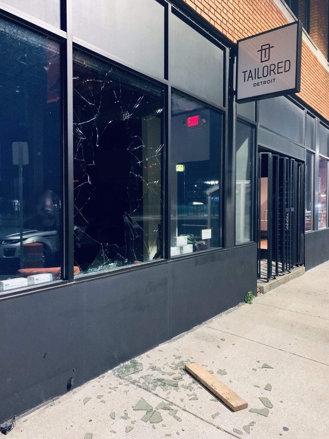 The would-be intruder at Tailored Detroit used a wooden plank and several chunks of concrete to break through a double-paned window.