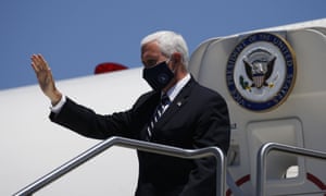“Put a mask on it”Vice President Mike Pence waves as he arrives to meet with Arizona governor Doug Ducey to discuss the surge in coronavirus cases.
