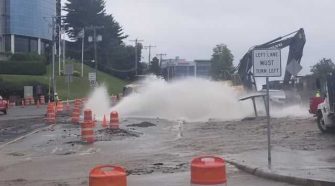 Massive water main break floods roads in Waltham, closes Route 128 exit