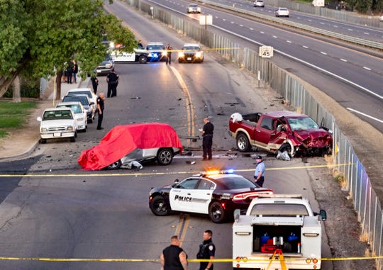 CHP and Visalia Police investigate a deadly head-on collision on Mineral King Avenue at Crumal Street on Monday, July 6, 2020. The truck left westbound Highway 198 through chain-link fence about a half-mile before striking the eastbound car. Both occupants of the car died at the scene, the driver of the truck was transported to a local hospital.
