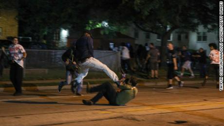 Clashes between protesters and at least one armed civilian break out during the third day of protests over the shooting of Jacob Blake by a police officer in Wisconsin. 