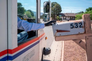 A USPS worker delivers mail in El Paso, Texas, during the pandemic.