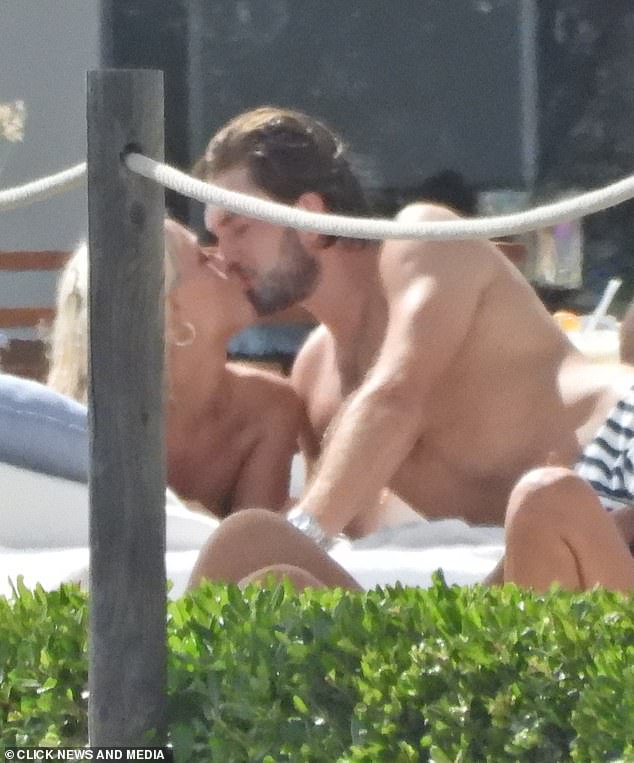 New relationship: MailOnline revealed the new couple had grown close in July, with the pair confirming their romance by holding hands and kissing in Ibiza at the end of last month