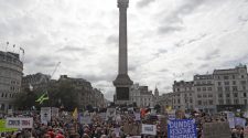 The Latest: Police move to break up London virus protest