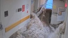 Video shows moment raging flood breaking through emergency doors causing Massachusetts hospital closure