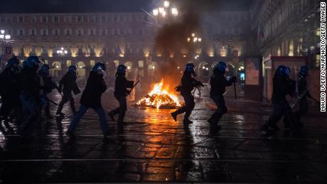 Protesters clash with police in northern Italy as anger mounts over Covid-19 restrictions