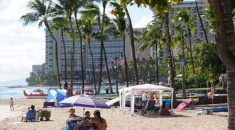 Families gather under tents at Waikiki Beach. Aug, 6 - Following a continued surge of COVID-19 cases and deaths, Mayor Caldwell’s Emergency Order 2020-23 includes the closure of City parks, most park facilities, all campgrounds, Botanical Gardens, and Community Gardens from Saturday, August 8 through Friday, September 4, 2020.