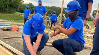 Students from Lancaster County Career & Technology Center's Mount Joy Campus help raise a large storage barn for Donegal Youth Soccer