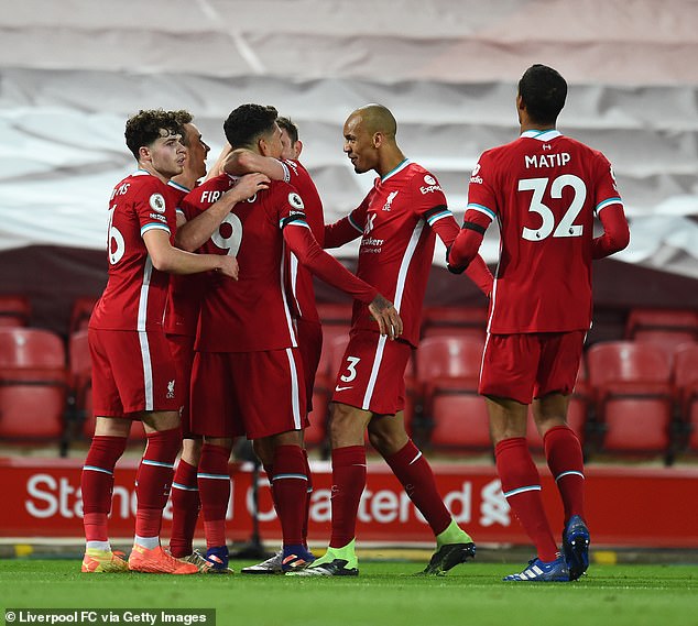 Firmino's Liverpool team-mates celebrated with the Brazilian striker after his goal on Sunday