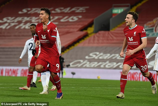 Firmino (left) celebrated with a huge sigh of relief after hitting the woodwork twice at Anfield