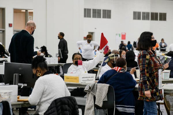 Workers with the Detroit Department of Elections counted absentee ballots in Detroit.