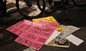 Protest signs are seen on the ground after a car struck multiple people at a protest, 11 December 2020 in New York City.