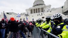 US Capitol secured after rioters stormed the halls of Congress to block Biden's win