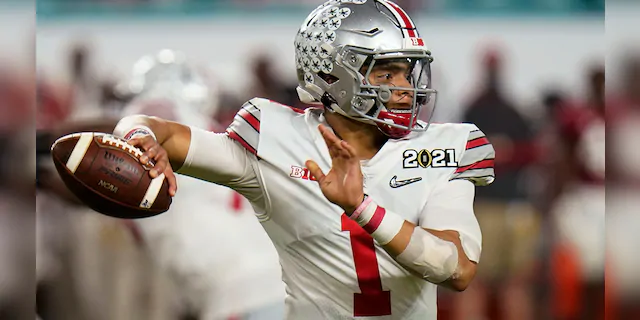 Ohio State quarterback Justin Fields passes against Alabama during the second half of an NCAA College Football Playoff national championship game, Monday, Jan. 11, 2021, in Miami Gardens, Fla. (AP Photo/Chris O'Meara)