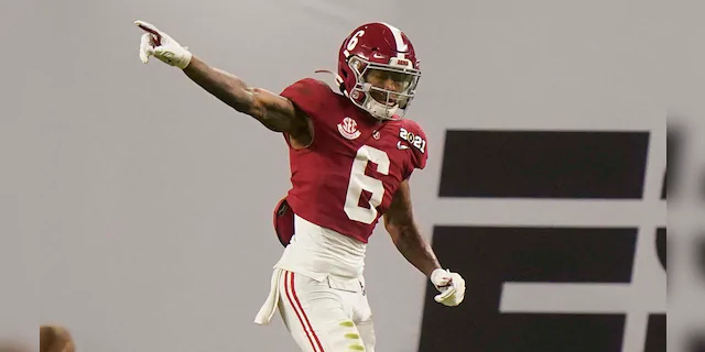 Alabama wide receiver DeVonta Smith celebrates after scoring against Ohio State during the first half of an NCAA College Football Playoff national championship game, Monday, Jan. 11, 2021, in Miami Gardens, Fla. (AP Photo/Lynne Sladky)